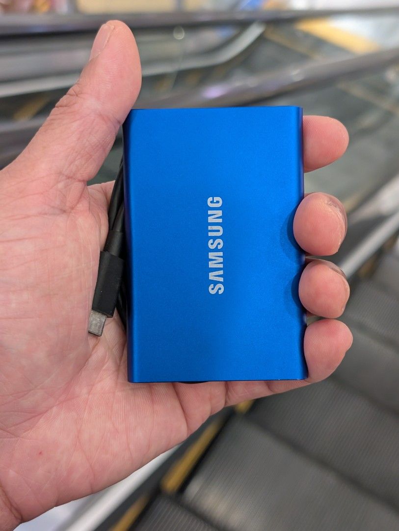 Samsung T7 Portable SSD 1TB Blue (Category: Hard Disks & Thumbdrives) located in Las Pinas. Submitted by adobongtofu (Listing ID 1456722622, Image 1). Description: - Samsung T7 Portable SSD - 1TB Capacity - Color: Blue - Model: MU-PC1T0H - Ultra-fast storage for files, photos, and videos - Compact and lightweight design - USB cable included - Perfect for backups and expanding storage.