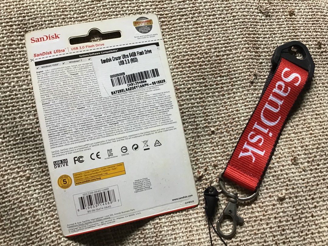 SanDisk USB 64gb (Category: Hard Disks & Thumbdrives) located in Manila. Submitted by carou35896 (Listing ID 1456743514, Image 2). Description: with free strap.
