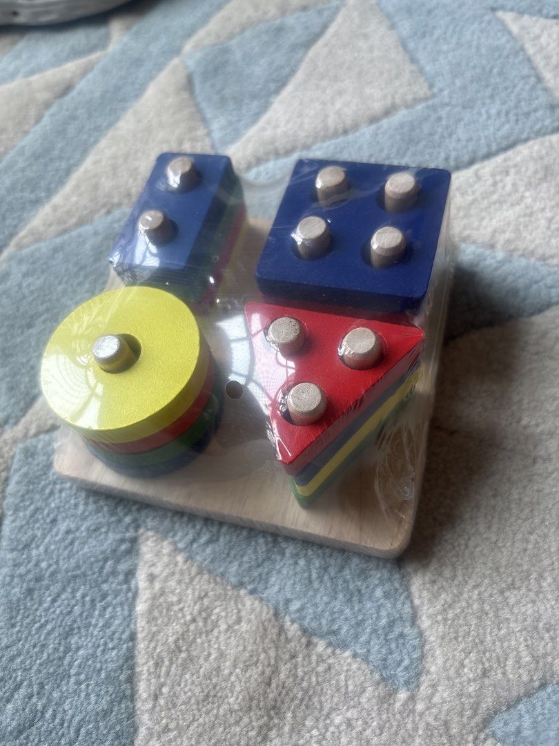 Shape stack toy (Category: Infant Playtime) located in Singapore. Submitted by luckyhorse.01129e (Listing ID 1456639519, Image 1). Description: Brand new toy, great for learning shapes and colours and practicing fine motor skills.