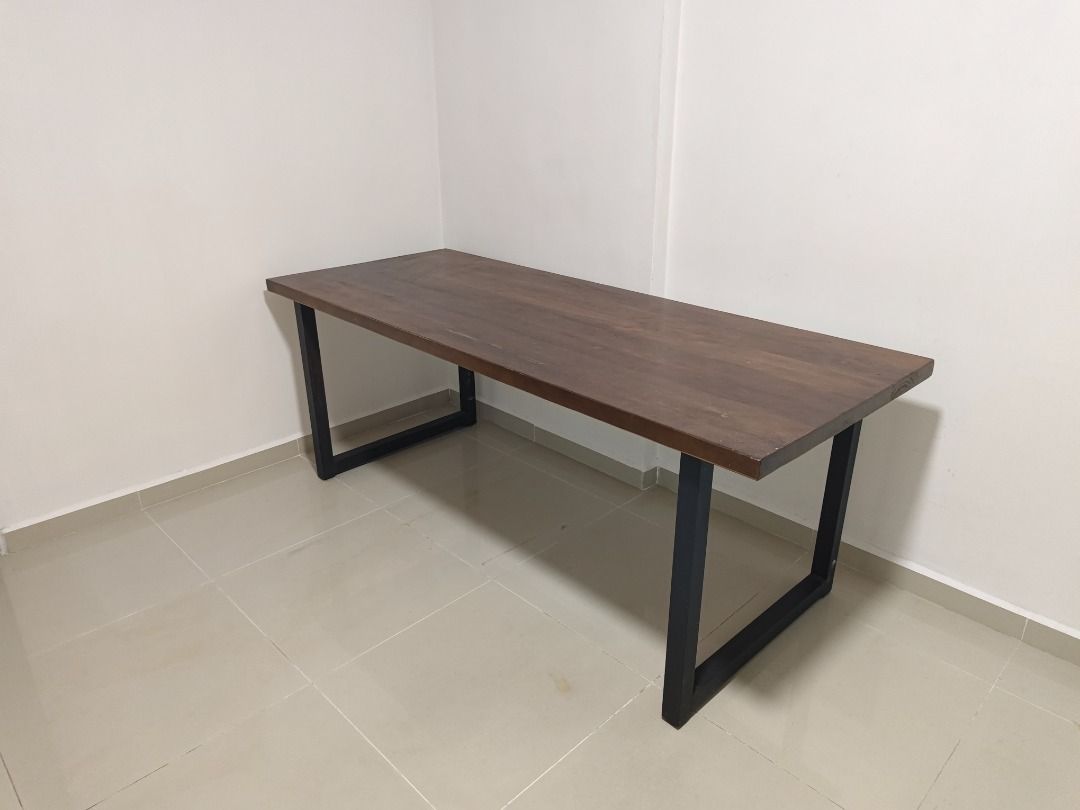 Solid wood dining table study table (Category: Tables & Sets) located in Singapore. Submitted by vvbeautystore (Listing ID 1456631201, Image 1). Description: Used but in good condition. Solid wood table top. Very sturdy. Easy to dismantle and transport. Two sets available. 200x80x75H @ $60 200x70x75H @ $50 Self collect at woodlands area.