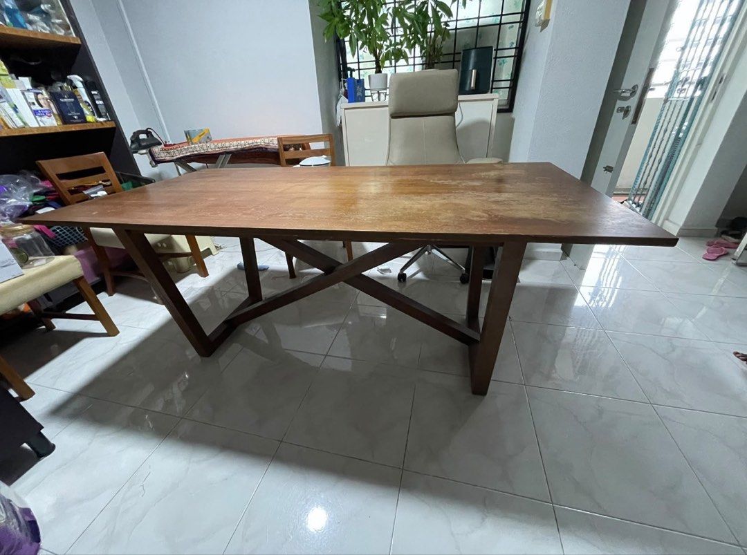 Solid Wooden Dining Table (Category: Tables & Sets) located in Singapore. Submitted by flynow168 (Listing ID 1456748022, Image 1). Description: - Solid wooden dining table - Dimensions: Approx. 180cm (L) x 75cm (W) x 75cm (H) - Shows some signs of wear consistent with use - Sturdy wooden legs - Perfect for family meals or as a workspace Pls arrange your delivery and collection. Negotiable for fast deal .