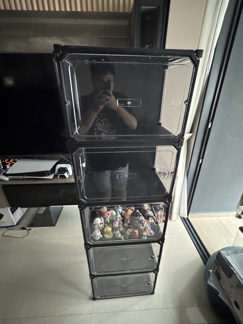 Stackable Clear Display Storage Boxes (Category: Storage Boxes & Baskets) located in Singapore. Submitted by yron02249148 (Listing ID 1456694247, Image 2). Description: - Set of stackable storage boxes - Ideal for displaying collectibles or shoes - Clear front door for easy access - Black frame with clear plastic panels - Stackable design to save space - Perfect for organizing your items come disassembled.