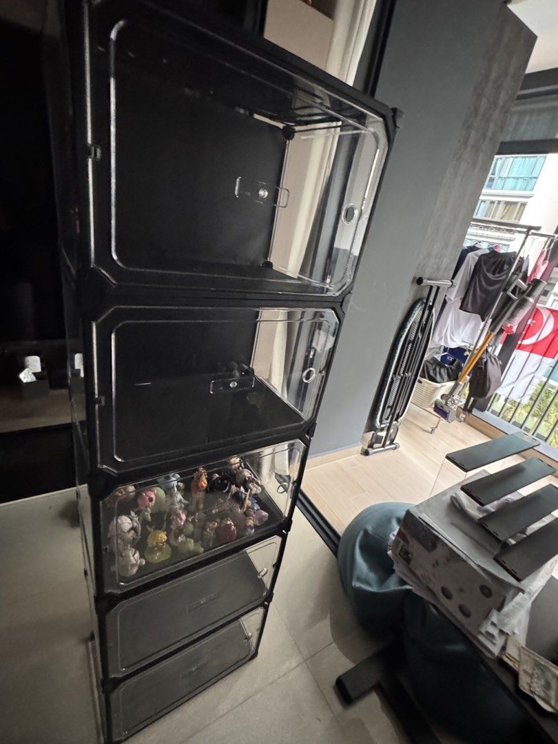 Stackable Clear Display Storage Boxes (Category: Storage Boxes & Baskets) located in Singapore. Submitted by yron02249148 (Listing ID 1456694247, Image 3). Description: - Set of stackable storage boxes - Ideal for displaying collectibles or shoes - Clear front door for easy access - Black frame with clear plastic panels - Stackable design to save space - Perfect for organizing your items come disassembled.