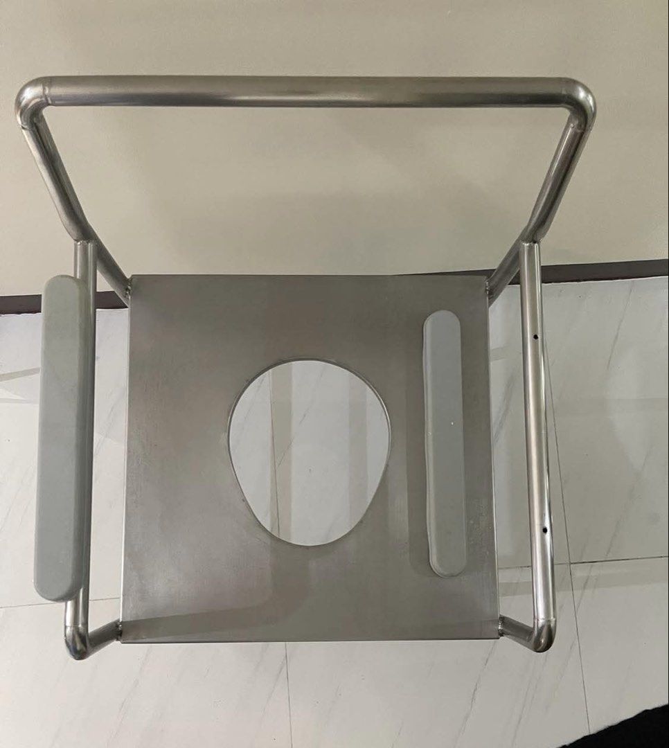 Stainless Steel Commode Chair with Armrests (Category: Medical Supplies & Tools) located in Mandaluyong City. Submitted by user4759642 (Listing ID 1456715195, Image 3). Description: - Durable stainless steel construction - Built-in armrests for enhanced support - Spacious seat opening for comfort - Sturdy metal frame with non-slip rubber leg stoppers - Excellent for individuals needing mobility assistance - Height from floor to knee 19 inch - wid