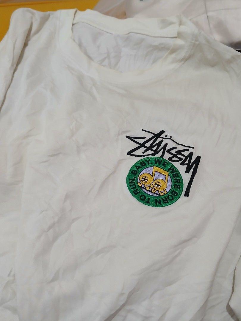 Stussy Graphic T-Shirt (Category: Tshirts & Polo Shirts ) located in Daraga. Submitted by thethriftcity2024 (Listing ID 1456740603, Image 2). Description: - White Stussy T-shirt - Unique graphic print on the back with various patches and designs - Small Stussy logo and circular patch on the front - Ideal for casual wear and streetwear style - Great for fans of the Stussy brand Excellent 21 x 28 cut tag issue 500+sf thank you.