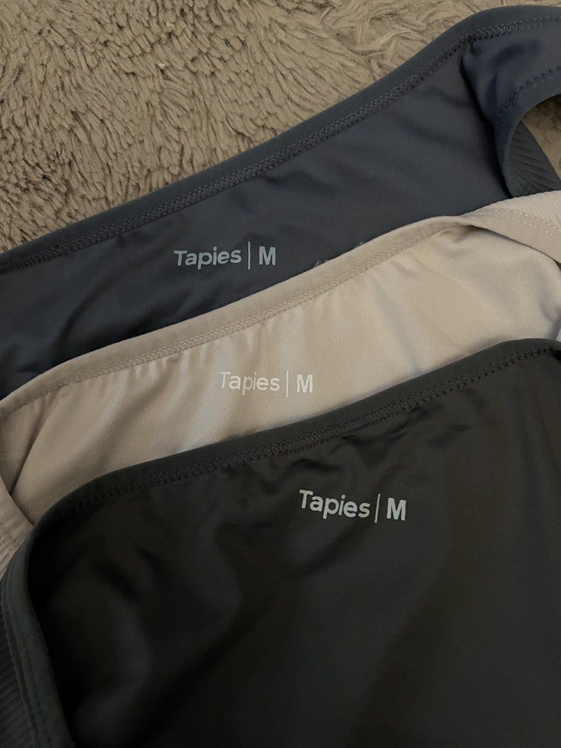 Tapies One Shoulder Ribbed Crop Top Size M (Category: Sleeveless) located in Manila. Submitted by cigeur_ (Listing ID 1456669685, Image 1). Description: - Set of Tapies one-shoulder ribbed crop tops - Available colors: Navy Blue, Beige, Dark Grey - Size: Medium (M) - Take all.