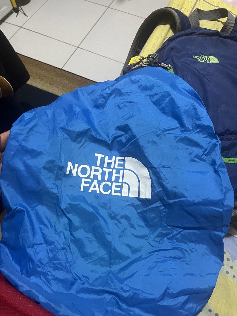 The North Face Orbit Backpack Blue Green (Category: Backpacks) located in Manila. Submitted by jankbaiteh05162 (Listing ID 1456627466, Image 2). Description: - Brand: The North Face - Model: Orbit - Color: Blue with green accents - Features: Multiple pockets, mesh side pockets - Includes: Blue rain cover with The North Face logo - Ideal for: Day trips, hiking.