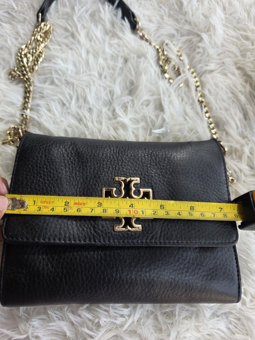 Tory Burch Britten Chain Wallet Black Leather (Category: Luxury Bags & Wallets) located in Lemery. Submitted by venus23 (Listing ID 1456618537, Image 3). Description: - Tory Burch chain wallet - Color: Black leather - Hardware: Gold tone - Features: Multiple card slots and compartments - Ideal for carrying your essentials - Replacement Strap.
