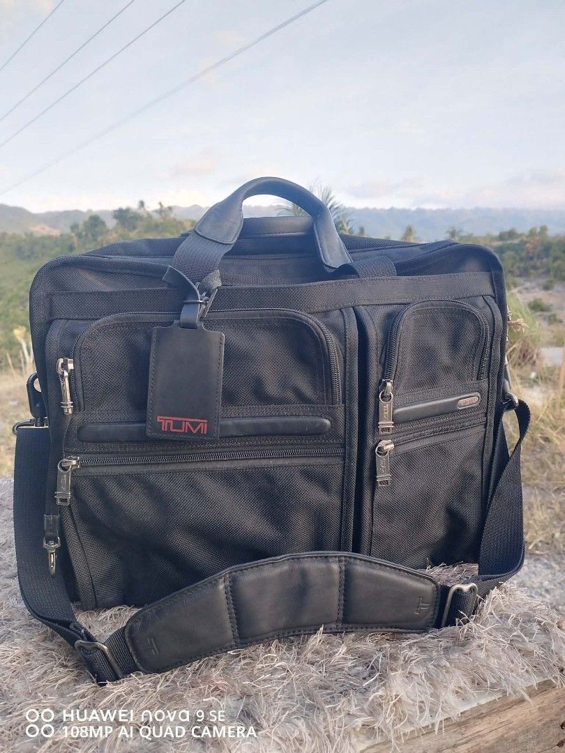 Tumi Black Nylon Briefcase Laptop Bag (Category: Briefcases) located in Cebu City. Submitted by tlisurplus (Listing ID 1456726307, Image 1). Description: - Tumi black nylon briefcase - Multiple compartments for excellent organization - Padded shoulder strap for comfortable carrying - Features Tumi ID Lock technology - Made in China - Ideal for both work and travel.