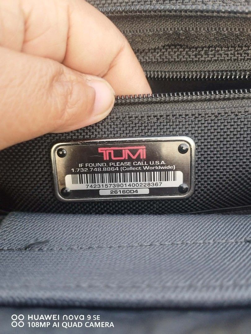 Tumi Black Nylon Briefcase Laptop Bag (Category: Briefcases) located in Cebu City. Submitted by tlisurplus (Listing ID 1456726307, Image 2). Description: - Tumi black nylon briefcase - Multiple compartments for excellent organization - Padded shoulder strap for comfortable carrying - Features Tumi ID Lock technology - Made in China - Ideal for both work and travel.