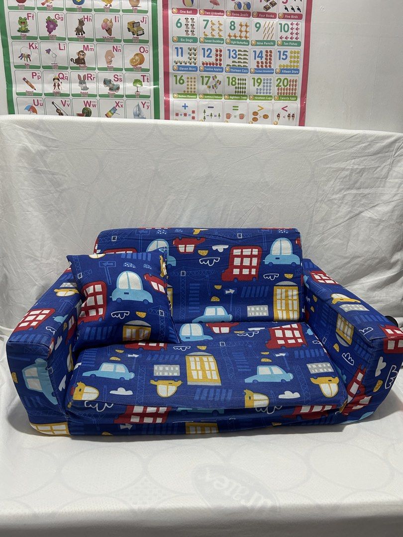 Uratex Kid Toddler Sofa bed (Category: Sofas) located in Pateros City. Submitted by cleanmycloset (Listing ID 1456714534, Image 1). Description: Preloved, unless stated brandnew. All items are declared AS IS. Pls manage your expectations. Can do tiiktokk checkout, courier apps, or self pick up. Payment first thru cashg or bank transfer. Coin is used for size comparison. .