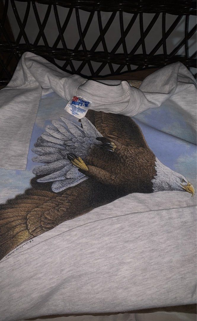 VINTAGE ART TEE FOR SALE (Category: Tshirts & Polo Shirts ) located in Angeles City. Submitted by browsetheracks (Listing ID 1456631139, Image 3). Description: FOR SALE 1991 HARLEQUIN EAGLE GRAPHIC ART TEE SIZE LARGE ON A HANES BEEFY TAG (22×28) *SINGLE STITCH ALL THE WAY, MADE IN USA MADE WITH HEAVY COTTON MATERIAL IN MINT CONDITION ✓ NO ISSUE ₱1550+SHIPPING FEE DM ME FOR MORE INFO 🔌 Note: Every item is photographed accurately to showcase its a