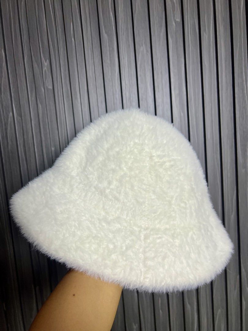 White Fuzzy Bucket Hat with Black CC Logo (Category: Hats & Beanies) located in Baguio. Submitted by chiechie1234 (Listing ID 1456690311, Image 3). Description: - Super soft and fuzzy white bucket hat - Features iconic black CC logo embroidered on the front - Provides sun protection while keeping you stylish - Ideal for casual outings or adding flair to any outfit - One size fits most.