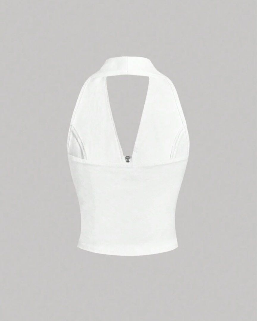 White Halter Neck Zipped Front Cropped Top (Category: Sleeveless) located in Manila. Submitted by itsandreaco (Listing ID 1456690177, Image 2). Description: - Body Measurements: Bust 34-36 - White halter neck cropped top - Deep V-neck with silver front zipper - Open back design.