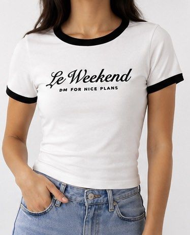 White 'Le Weekend' Ringer Tee (Category: Shirts) located in Las Pinas. Submitted by katb86 (Listing ID 1456685433, Image 2). Description: - Cute white ringer t-shirt - Black trim detail - Front graphic: 'Le Weekend DM FOR NICE PLANS' - Ideal for casual wear - Pairs well with jeans or shorts - Perfect for weekend outfits.