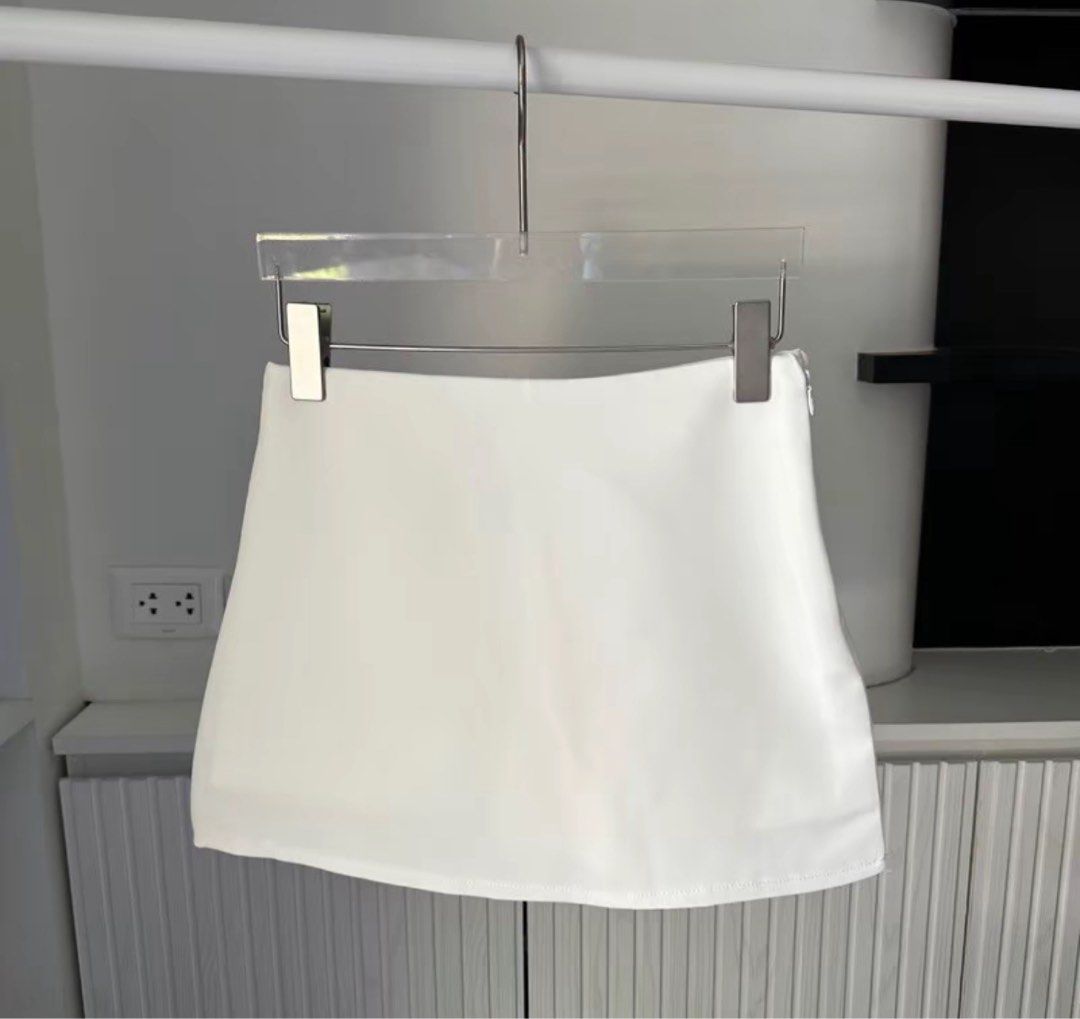 White Mini Skirt (Category: Skirts) located in Manila. Submitted by sbm_declutters (Listing ID 1456664317, Image 1). Description: - Simple white mini skirt - Built in shorts underneath - Flattering A-line cut - Convenient side zipper closure - Stylish faux leather material - Versatile: dress up or down - Easy to pair with any top.