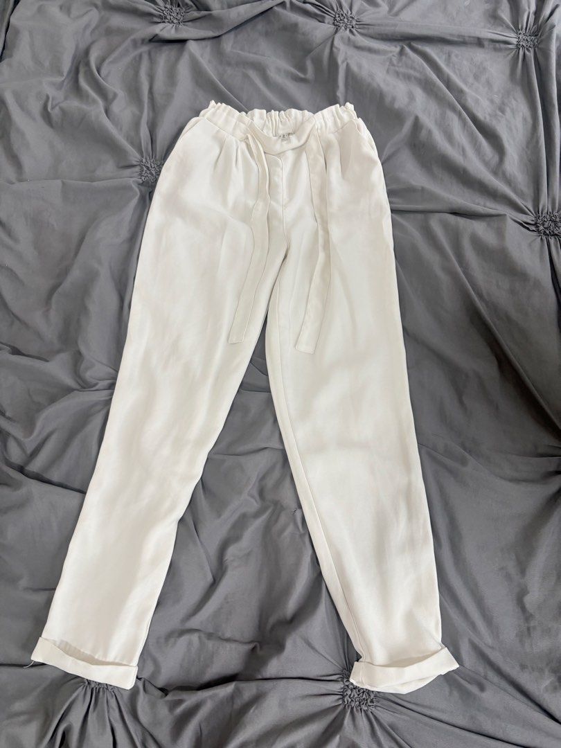 White Pants with Tie Belt (Category: Other Bottoms) located in Manila. Submitted by cluttersbya (Listing ID 1456627321, Image 2). Description: - White paperbag waist pants stretchable Small to Medium - Elasticated waistband with tie belt - Cropped length with cuffed hems - Lightweight material, ideal for warm weather - Versatile for dressing up or down - Comfortable fit.
