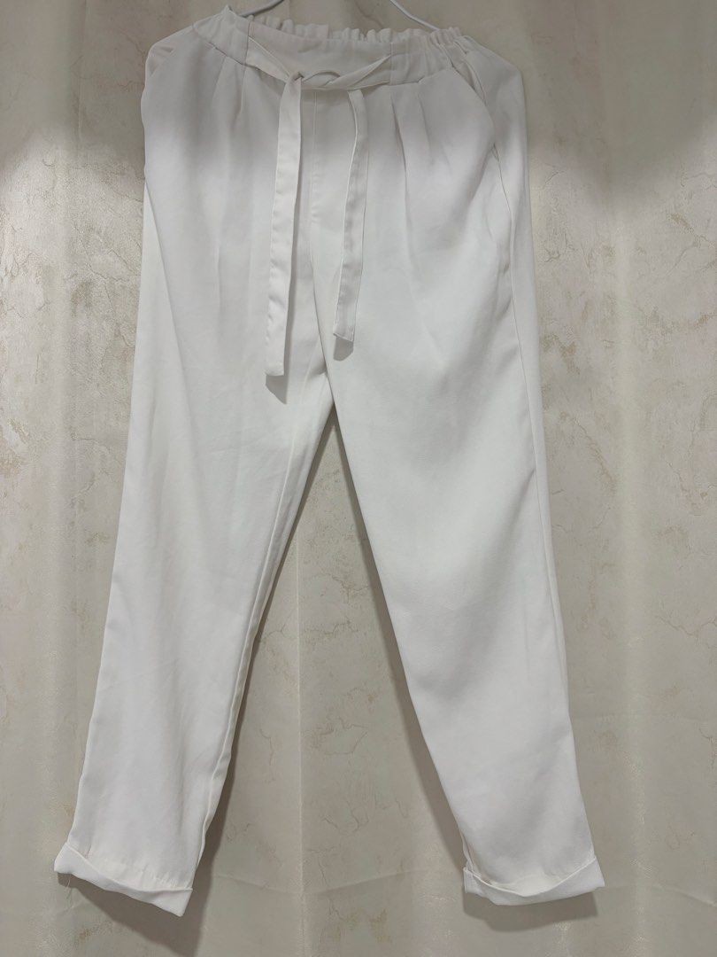 White Pants with Tie Belt (Category: Other Bottoms) located in Manila. Submitted by cluttersbya (Listing ID 1456627321, Image 1). Description: - White paperbag waist pants stretchable Small to Medium - Elasticated waistband with tie belt - Cropped length with cuffed hems - Lightweight material, ideal for warm weather - Versatile for dressing up or down - Comfortable fit.
