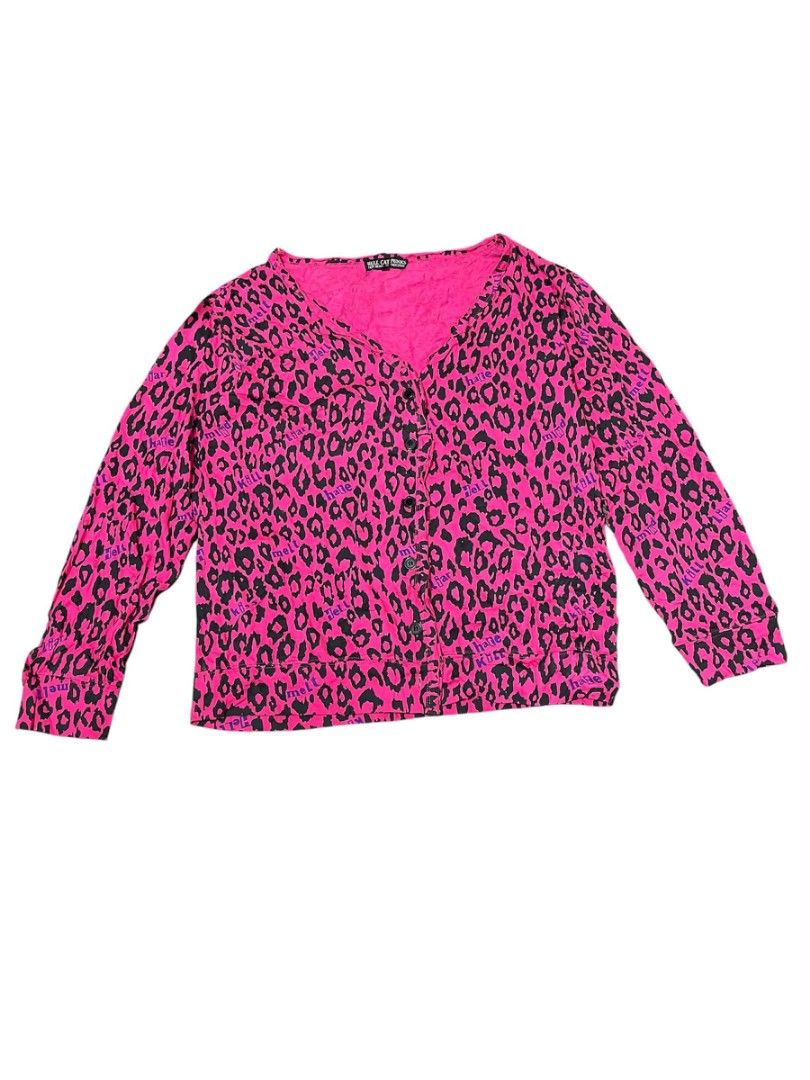 Y2K Hell Cat Punks Long Sleeves (Category: Longsleeves) located in Zamboanga. Submitted by archivist_ (Listing ID 1456738864, Image 1). Description: - Y2K Hell Cat Punks long-sleeved top - Vibrant hot pink and black leopard print - Features 'Hell Cat Punks - Not Dead @ Original' branding - Size: Large (L) - Lightweight and comfortable fabric - Perfect for a retro, edgy style.