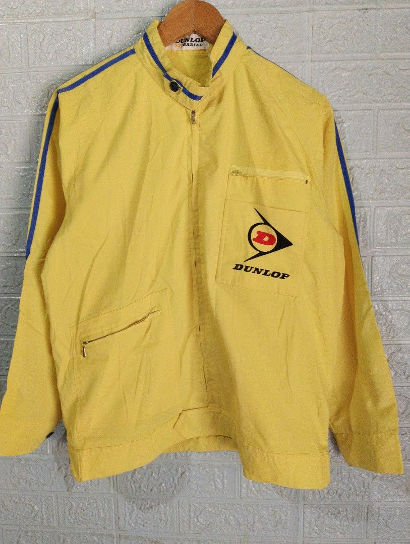 Yellow Dunlop SP Radial Racing Jacket (Category: Coats, Jackets and Outerwear) located in Davao. Submitted by noelamihan05424 (Listing ID 1456614082, Image 2). Description: - Cool yellow jacket with Dunlop SP Radial branding. - Features blue stripes on the sleeves and collar. - Has front pockets. - Perfect for Dunlop fans or a retro racing look. - Size X on tag. - Best fit Large to XL - Dimes 22x27 - Color rate 10/10 - No issue .