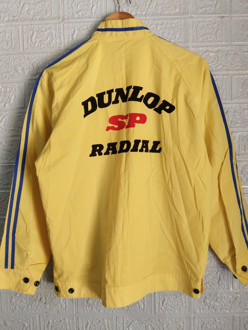 Yellow Dunlop SP Radial Racing Jacket (Category: Coats, Jackets and Outerwear) located in Davao. Submitted by noelamihan05424 (Listing ID 1456614082, Image 1). Description: - Cool yellow jacket with Dunlop SP Radial branding. - Features blue stripes on the sleeves and collar. - Has front pockets. - Perfect for Dunlop fans or a retro racing look. - Size X on tag. - Best fit Large to XL - Dimes 22x27 - Color rate 10/10 - No issue .