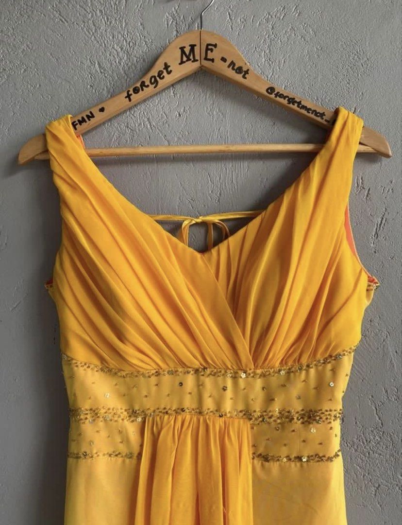 Yellow Gown with Beaded Waist and Open Back (Category: Evening dresses & gowns) located in Binan City. Submitted by forgetmenot_ph (Listing ID 1456671637, Image 3). Description: - Flowy yellow gown - Flattering V-neckline with ruched detailing - Elegant beaded embellishment at the waist - Chic open back with adjustable tie closure - Contrasting orange lining for a pop of color - Sheer overlay on the hemline for added flair - Ideal for special eve