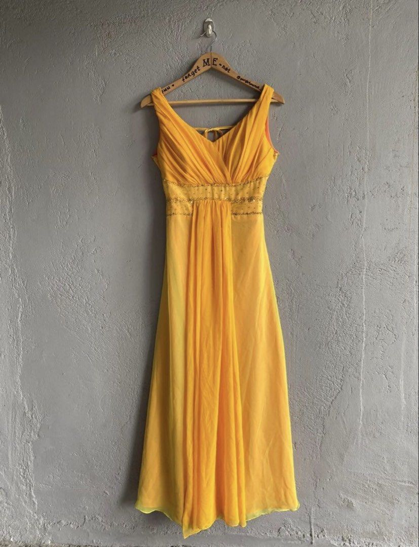 Yellow Gown with Beaded Waist and Open Back (Category: Evening dresses & gowns) located in Binan City. Submitted by forgetmenot_ph (Listing ID 1456671637, Image 1). Description: - Flowy yellow gown - Flattering V-neckline with ruched detailing - Elegant beaded embellishment at the waist - Chic open back with adjustable tie closure - Contrasting orange lining for a pop of color - Sheer overlay on the hemline for added flair - Ideal for special eve