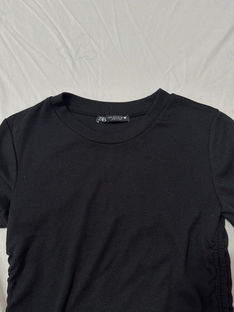 Zara Black Ribbed Ruched Drawstring T-shirt Top (Category: Shirts) located in Masbate. Submitted by anjcbr (Listing ID 1456603844, Image 1). Description: - Zara Black Ribbed Ruched Drawstring T-shirt Top - Short sleeves and crew neck - Ruching and drawstring details on the sides - Adjustable length with drawstrings - Bought in store for ₱695-₱795 - Used 3-4x only - Slight color variations on the photo due to lighting.