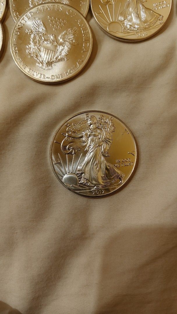 2022 American Silver Eagle Coin (Category: Currency) located in Manila. Submitted by your_store110987 (Listing ID 1456877629, Image 2). Description: - 2022 American Silver Eagle Coin - 1 oz of.999 fine silver - Iconic Lady Liberty and bald eagle designs - Ideal for coin collectors and investors.