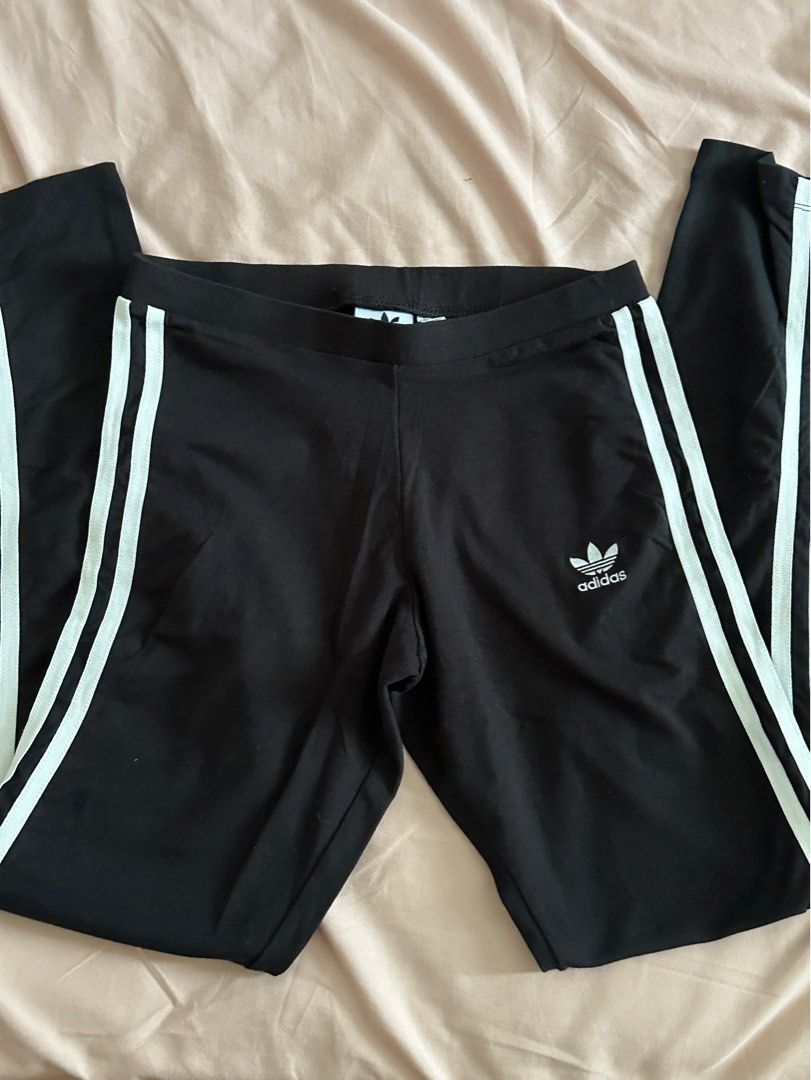 Adidas Black Leggings with White Stripes (Category: Shorts) located in Santa Rosa. Submitted by aikcat (Listing ID 1456890525, Image 1). Description: - Classic black Adidas shorts - Iconic white three stripes on sides - Adidas trefoil logo on left leg - Comfortable elastic waistband - Perfect for workouts or casual style.