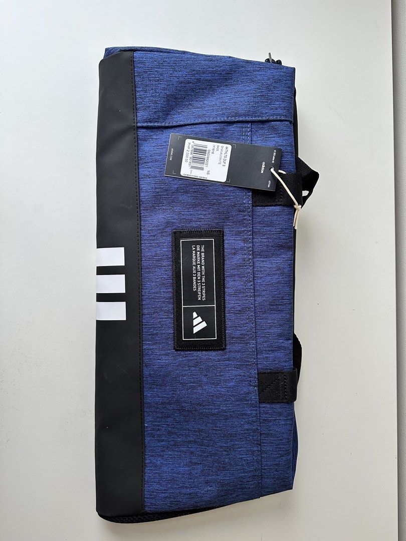 Adidas Small Duffel bag (Category: Sling Bags) located in Quezon City. Submitted by donsalta (Listing ID 1456884417, Image 3). Description: - Brand newAdidas duffel bag - Detachable shoulder strap - Ideal for gym sessions or travel - Original tag still attached.