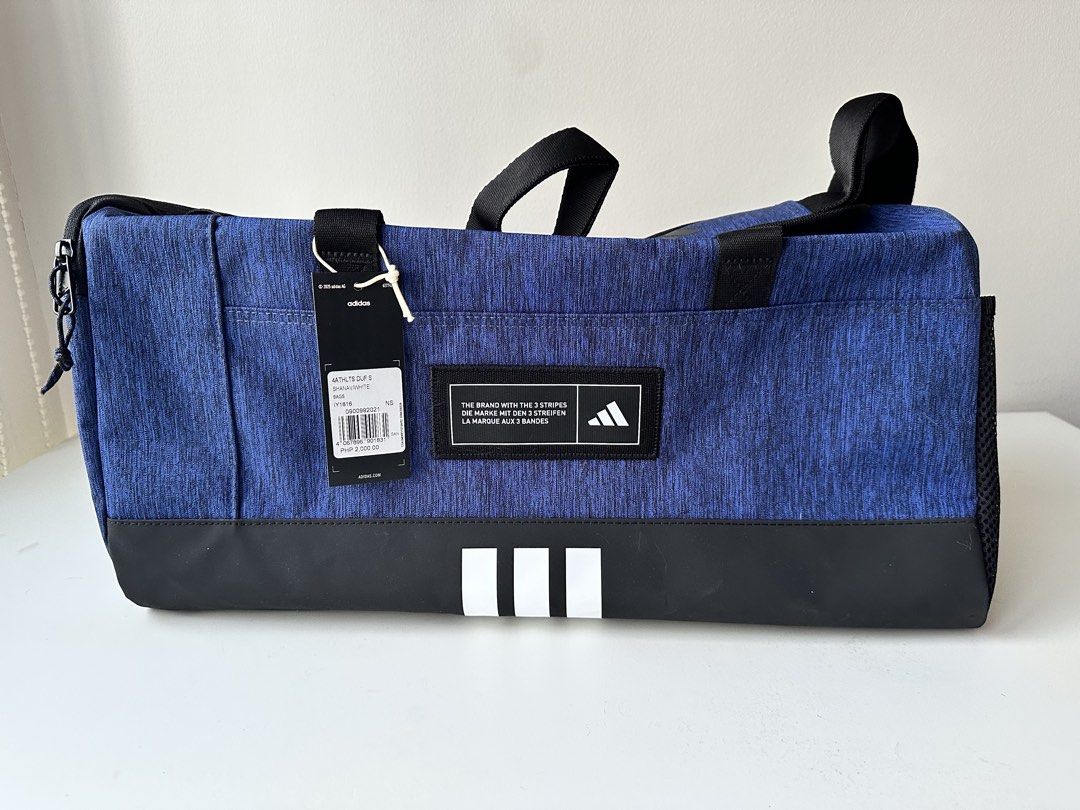 Adidas Small Duffel bag (Category: Sling Bags) located in Quezon City. Submitted by donsalta (Listing ID 1456884417, Image 1). Description: - Brand newAdidas duffel bag - Detachable shoulder strap - Ideal for gym sessions or travel - Original tag still attached.