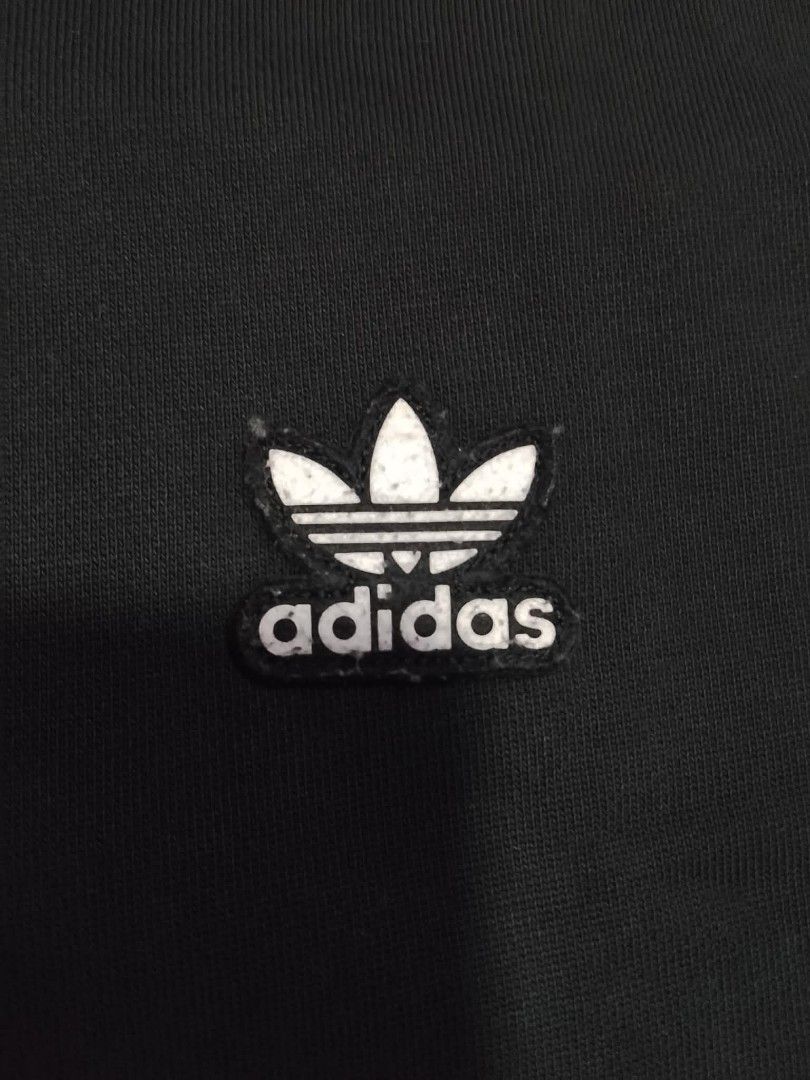 ADIDAS TREFOIL ESSENTIAL BLACK PULLOVER HOODIE (Category: Coats, Jackets and Outerwear) located in Mexico. Submitted by thethrift010203 (Listing ID 1456867489, Image 3). Description: AUTHENTIC/LEGIT ADIDAS TREFOIL ESSENTIAL BLACK PULLOVER HOODIE Color : BLACK Fabic : 95% COTTON 5%ELASTANE Size on tag: LARGE KASYA SA LARGE TO XL FIT XXL SOBRANG GANDA COMPORTABLE ISUOT, EMBROIDERER LOGO Width : 24.2 Length : 29.1 Condition : EXCELLENT CONDITION Iss