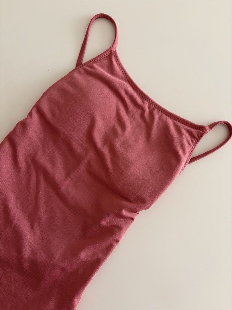 AguaRiva Minima Onesie (Category: Others Tops) located in Quezon City. Submitted by secondhandlifestyle (Listing ID 1415828061, Image 3). Description: - Full piece swimsuit - Color: Dusty rose - Size: XS - Design: Low back, high-cut leg - Material: Stretchy fabric - Cute on the bum 🍑 - Barely visible laundry stain (I handwash!) in the last photo Cute in high waist shorts or in a jumpsuit! Personal fave but time to let go 🩷 MOP: GCash Shipping b