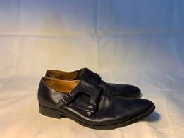 ALDO Black Leather Double Monk Strap Shoes (Category: Dress Shoes) located in Caloocan City. Submitted by jajalovesyou (Listing ID 1456812285, Image 2). Description: - Classic black leather double monk strap shoes - Sleek, pointed toe design - Leather shows some creasing from wear - Double buckle closure is intact - Versatile for smart casual or formal occasions - Ready for a new owner.