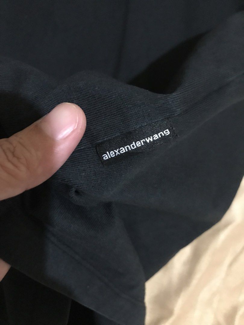 Alexander Wang Black T-Shirt (Category: Luxury Apparel) located in Rizal. Submitted by drthriftone (Listing ID 1456937729, Image 3). Description: - Authentic Alexander Wang T-shirt - Size: Large (L) - Front Chest: 'wang' logo detail - Back: 'Alexanderwang' logo detail - Material: Comfortable fabric - Style: Ideal for casual everyday wear.