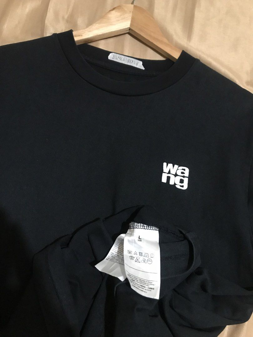 Alexander Wang Black T-Shirt (Category: Luxury Apparel) located in Rizal. Submitted by drthriftone (Listing ID 1456937729, Image 2). Description: - Authentic Alexander Wang T-shirt - Size: Large (L) - Front Chest: 'wang' logo detail - Back: 'Alexanderwang' logo detail - Material: Comfortable fabric - Style: Ideal for casual everyday wear.