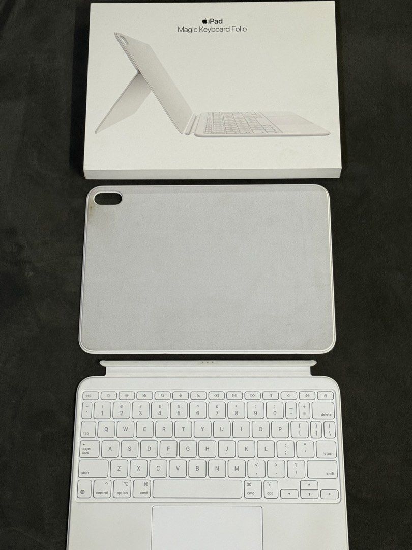Apple iPad Magic Keyboard Folio (Category: Computer Keyboard) located in Urdaneta. Submitted by myriville (Listing ID 1456802298, Image 1). Description: - Apple Magic Keyboard Folio for iPad - Folio style with integrated keyboard and trackpad - Magnetic attachment to your iPad - Enhances typing and navigation experience - Comes with original packaging - Feel free to ask any questions! Purchased: April 2026 RFS: Upgraded to Macbook.