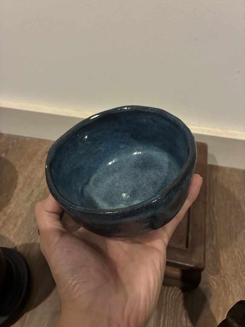 Artisan Japanese Chawan Tea bowl (Category: Other Kitchenware & Tableware) located in Cavite. Submitted by threadscollective (Listing ID 1456869344, Image 2). Description: - Beautiful handmade ceramic bowl - Deep blue glaze with a speckled finish - Unique, slightly irregular shape - Great for serving or as a decorative piece - Measures approximately [13cm diameter x 8cm height].