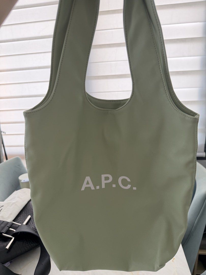 Authentic A.P.C. Tote Ninon Small Vert Amande Bag (Category: Luxury Bags & Wallets) located in Taguig. Submitted by claire08hyun (Listing ID 1456832971, Image 2). Description: - A.P.C. tote bag - Color: Light green (Vert Amande) - Size: Small - Features an interior pocket - Comes with original tags - Ideal for everyday use.
