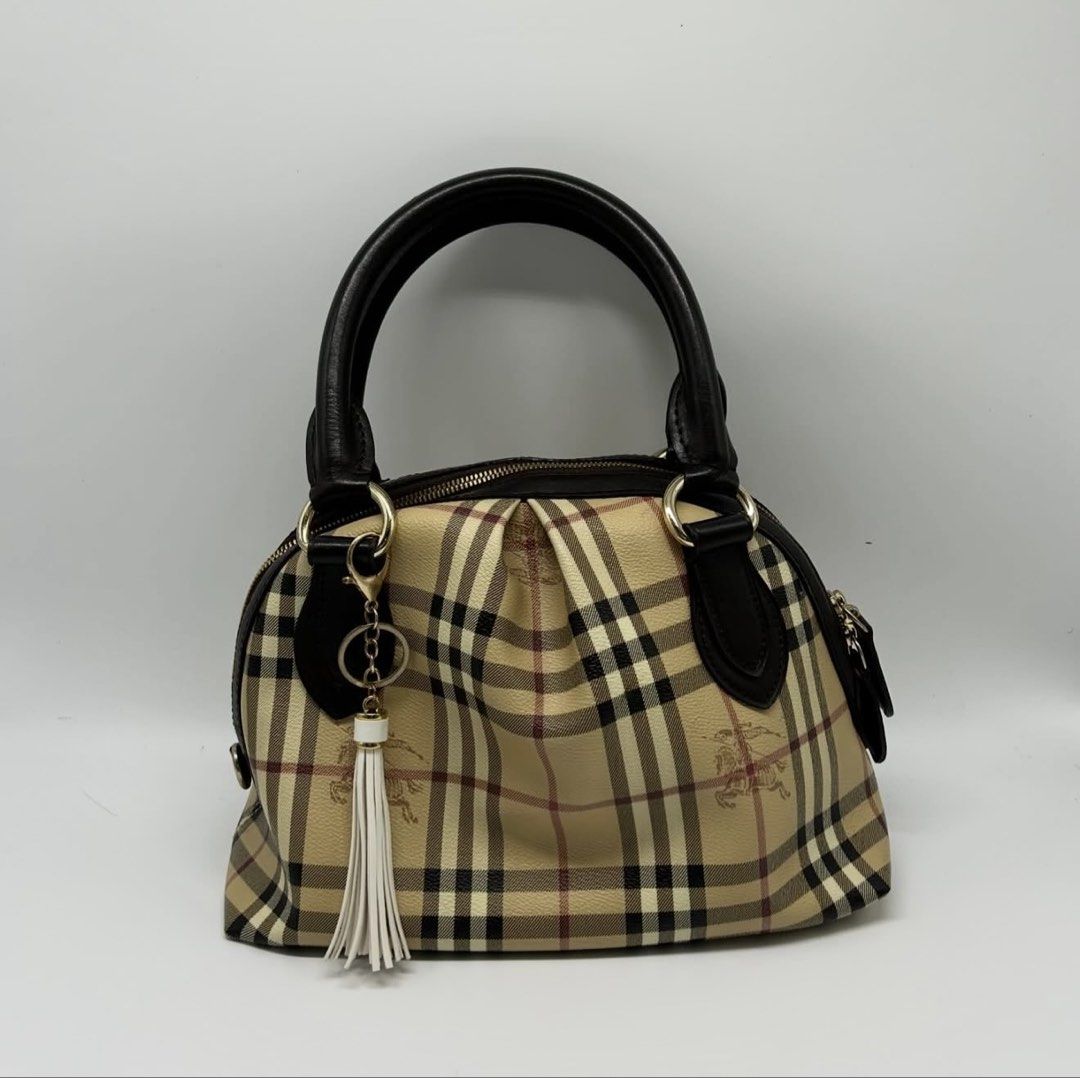 Authentic Burberry Haymarket Handbag (Category: Luxury Bags & Wallets) located in Pasay City. Submitted by xwhatsinmycloset (Listing ID 1456822369, Image 1). Description: FOR SALE OR SWAP Authentic Burberry Haymarket Handbag Good pre-owned condition with signs of normal use; minor leather fading/wear on handles. Zippers and hardware are fully functional.