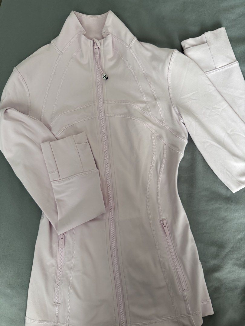 Authentic Lululemon Light Pink Define Jacket Nulu (Category: Coats, Jackets and Outerwear) located in Taguig. Submitted by claire08hyun (Listing ID 1456859117, Image 3). Description: - Light pink Lululemon jacket - Full zip closure with stand-up collar - Two zippered front pockets - Thumbholes at cuffs - Ideal for workouts or casual wear - Comfortable and breathable material -used twice because it’s too long for me -size 2 .