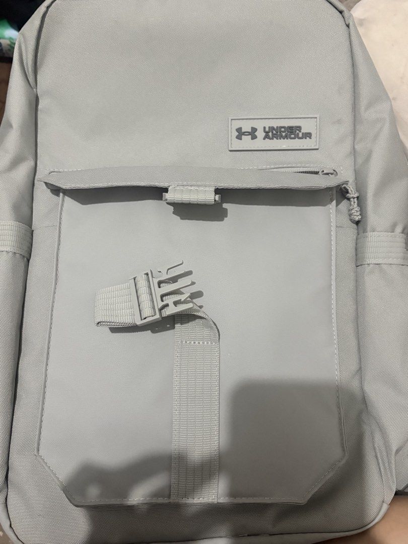 Authentic Under Armour Triumph Campus Unisex Backpack – White/Gray (Category: Backpacks) located in Manila. Submitted by hyunjinnnndeclutter (Listing ID 1456872383, Image 1). Description: Description: Under Armour Triumph Campus Unisex Backpack in white/gray. * Authentic Under Armour * Spacious main compartment * Front zip pocket + large front pocket * Side pockets * Adjustable padded straps * Unisex design * Clean overall condition with some sig