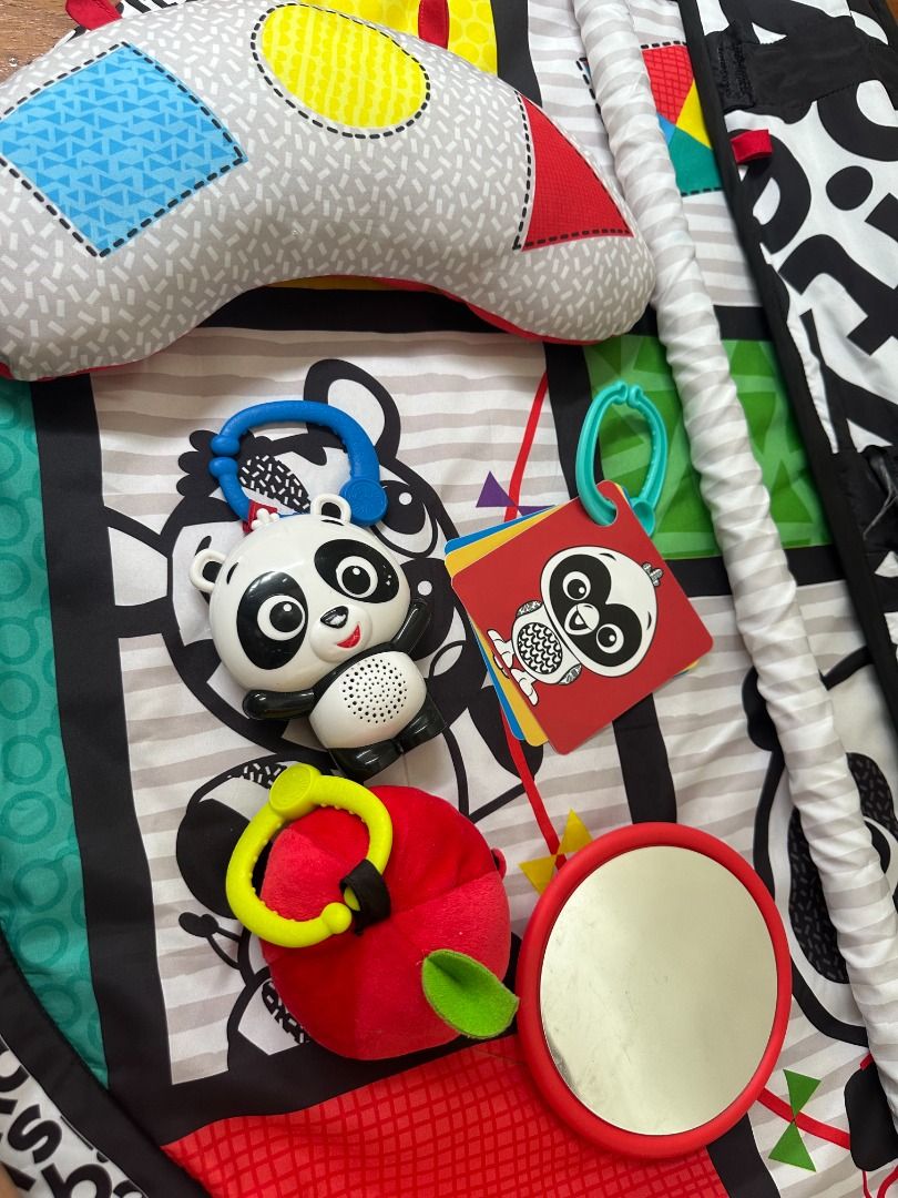 Baby Einstein Bold New World High Contrast Playmat (Category: Infant Playtime) located in Makati City. Submitted by travelfinds34611 (Listing ID 1456856902, Image 2). Description: - Play gym perfect for tummy time and play. - Comes with a comfy bolster pillow. - Includes engaging hanging toys: panda, mirror, and rattle (apple). - Black and white patterned mat designed for visual stimulation. - Easily folds up for convenient storage. High-Contrast