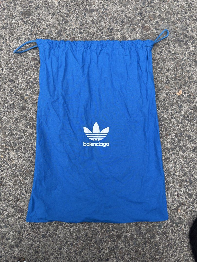 BALENCIAGA X ADIDAS BAG (Category: Luxury Bags & Wallets) located in Lapu Lapu. Submitted by thatdamngrails (Listing ID 1456828356, Image 1). Description: - Brand: Balenciaga x Adidas - Type: Drawstring Bag - Color: Blue - Gender: Unisex - Condition: Good (Layered condition 7) - Features: Iconic collaboration logo, drawstring closure No tags.