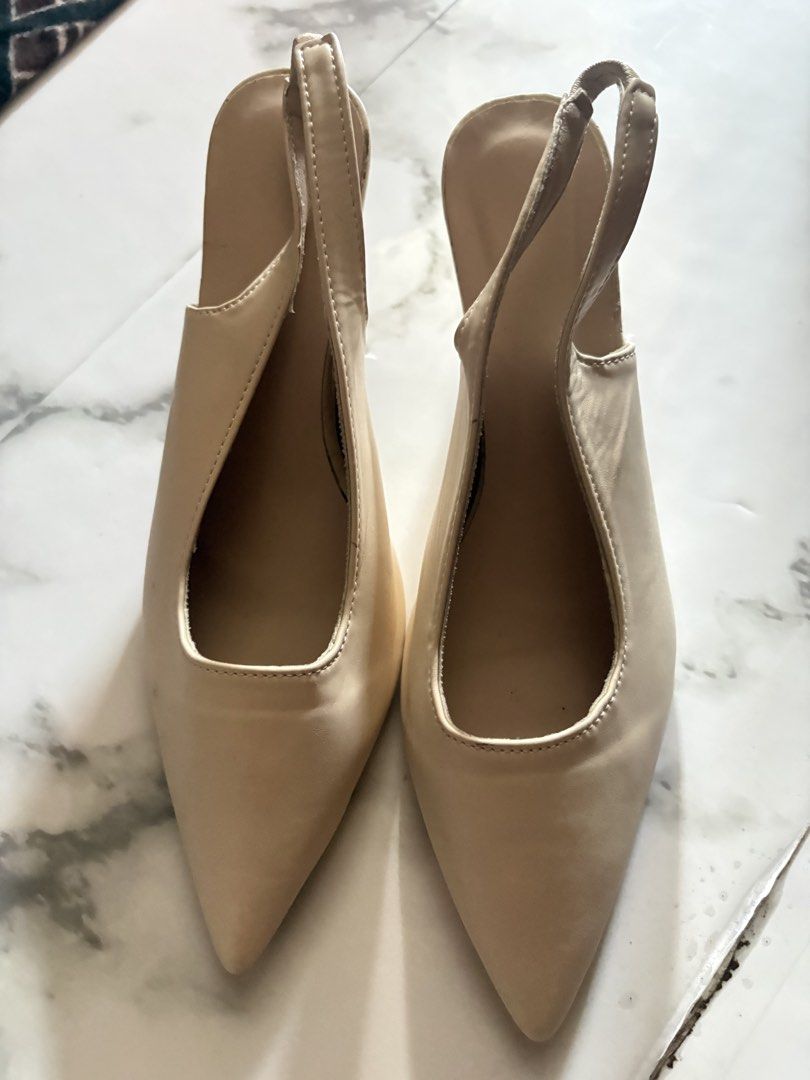 Beige Slingback Pointed Toe Heels (Category: Heels) located in Muntinlupa City. Submitted by urxyy (Listing ID 1456804943, Image 2). Description: - Beige slingback heels - Pointed toe - Low heel - Comfortable elastic slingback strap - Versatile color for various outfits - Ideal for work or casual outings.