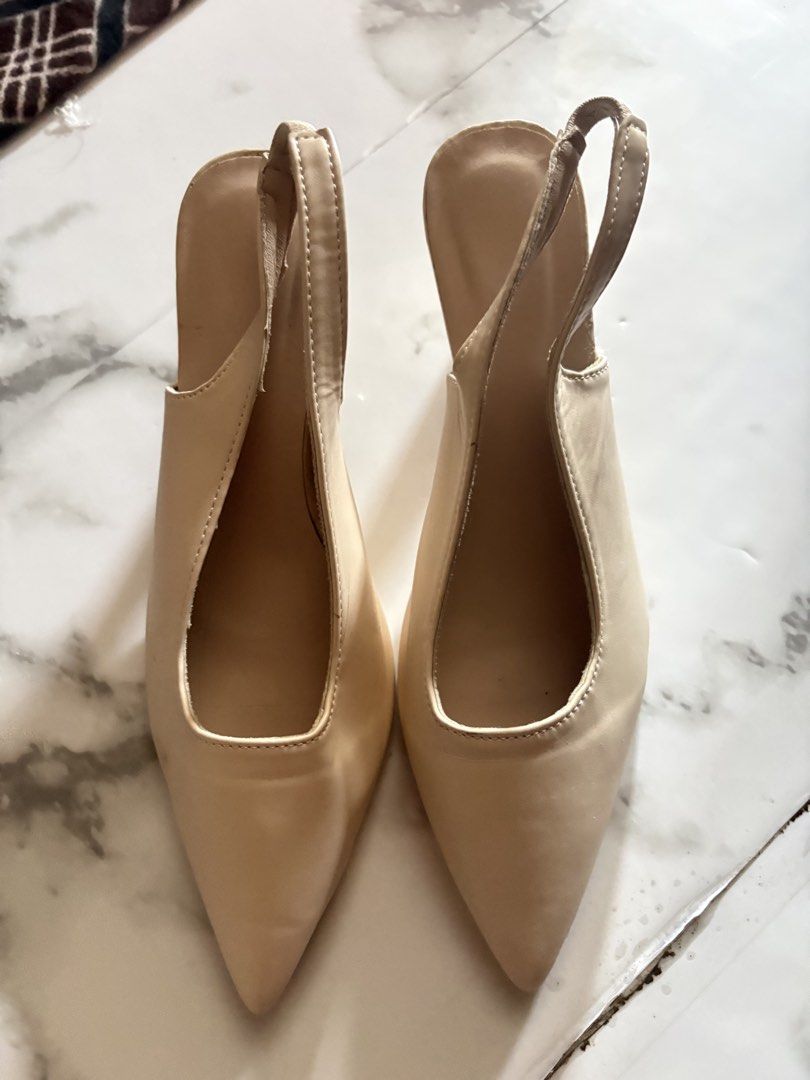 Beige Slingback Pointed Toe Heels (Category: Heels) located in Muntinlupa City. Submitted by urxyy (Listing ID 1456804943, Image 1). Description: - Beige slingback heels - Pointed toe - Low heel - Comfortable elastic slingback strap - Versatile color for various outfits - Ideal for work or casual outings.