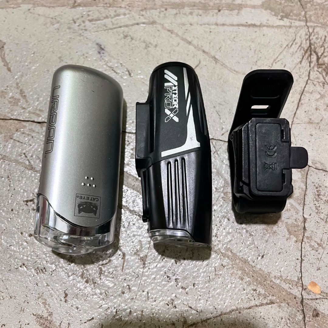 Bike Light Bundle (Both from Japan) (Category: Bicycles) located in Calamba. Submitted by ronan_rndms2026 (Listing ID 1456906995, Image 1). Description: Specs: Moon Meteor X Auto Pro - Max Output: 600 lumens - LED Type: 1 high-brightness LED - Battery: Rechargeable 1600 mAh Lithium-Ion (quick-replaceable) - Charging Time: Approx. 2.5 hours via Micro-USB - Dimensions: 88 x 30 x 29.5 mm - Weight: 85 g - Water Resistance: IPX4 (splash-proof) - Light