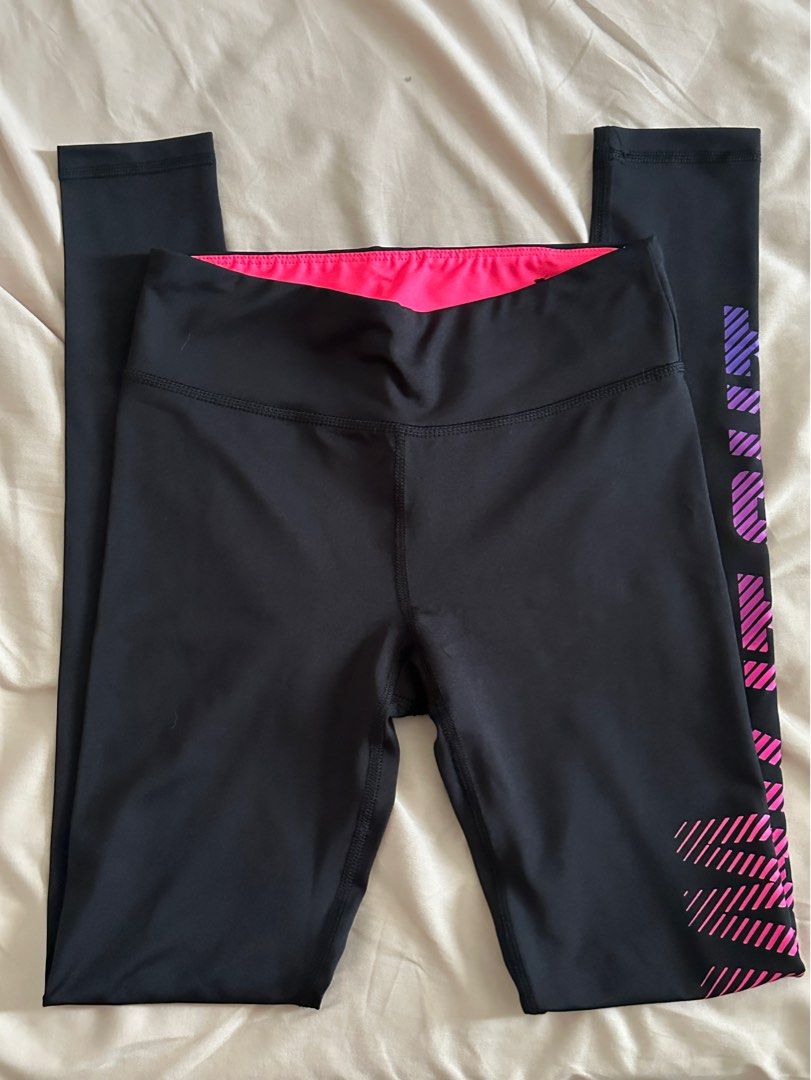 Black leggings with side detail (Category: Other Bottoms) located in Santa Rosa. Submitted by aikcat (Listing ID 1456890390, Image 1). Description: - Stylish black leggings with a vibrant pink and purple “work it out” - Features a comfortable wide waistband with a bright pink lining.