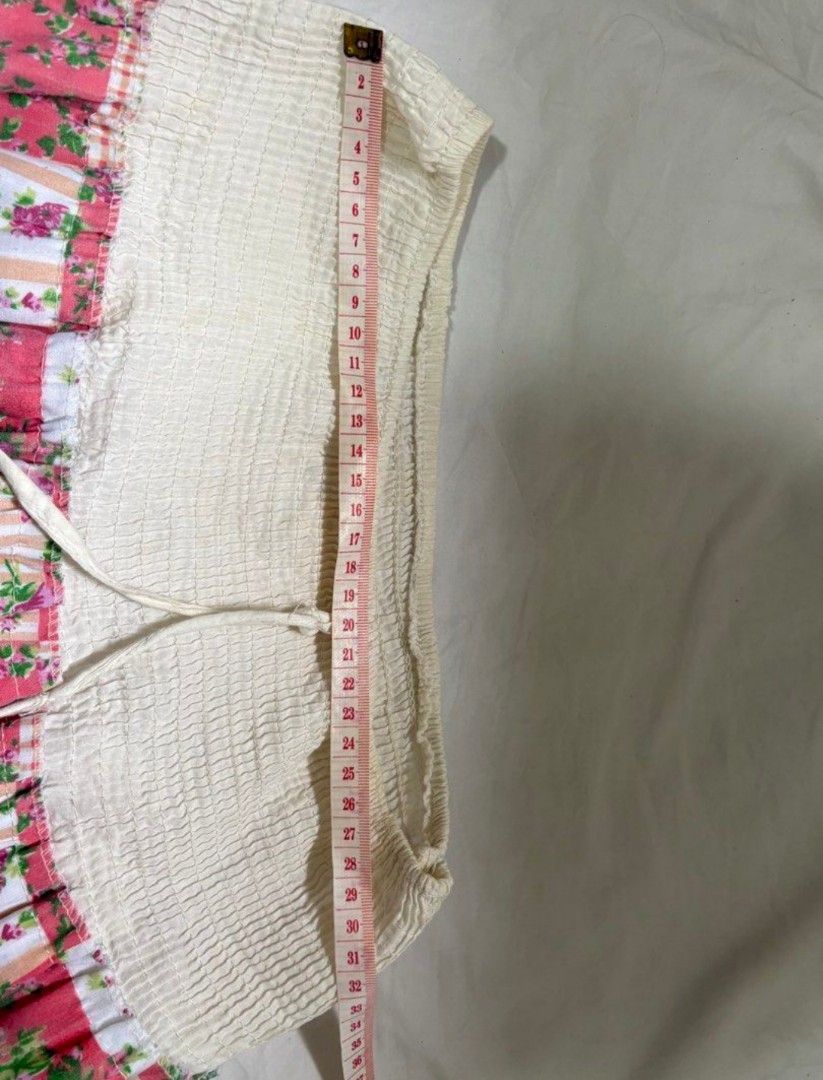 Boho Patchwork Tiered Maxi Skirt (Category: Skirts) located in Silang. Submitted by klnnnn (Listing ID 1456895244, Image 2). Description: - Cream tiered maxi skirt - Features a patchwork floral print section - Elasticated waistband with a drawstring for adjustable fit - Delicate lace trim details between tiers - Comfortable and flowy design - Perfect for achieving a bohemian look.